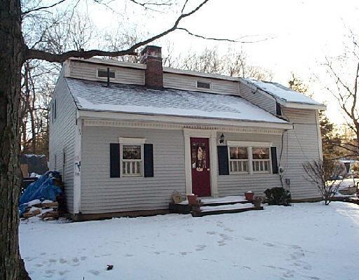 a view of a house with a snow on the road
