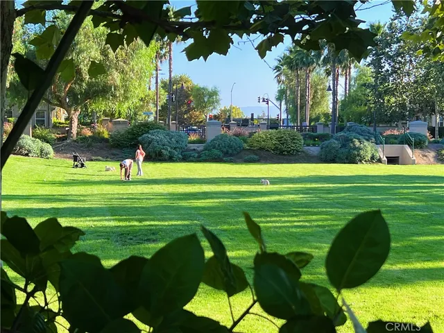 a large kitchen with stainless steel appliances granite countertop a large counter top and a stove