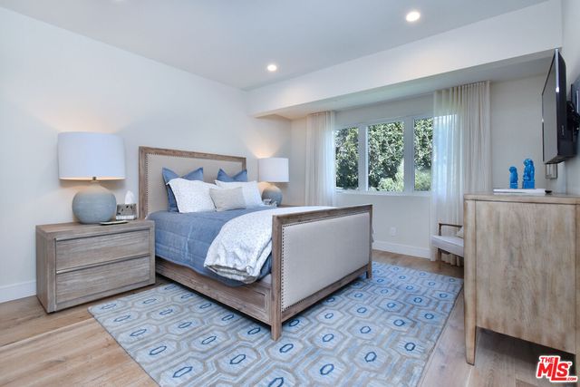 a bed room with a bed and a couch