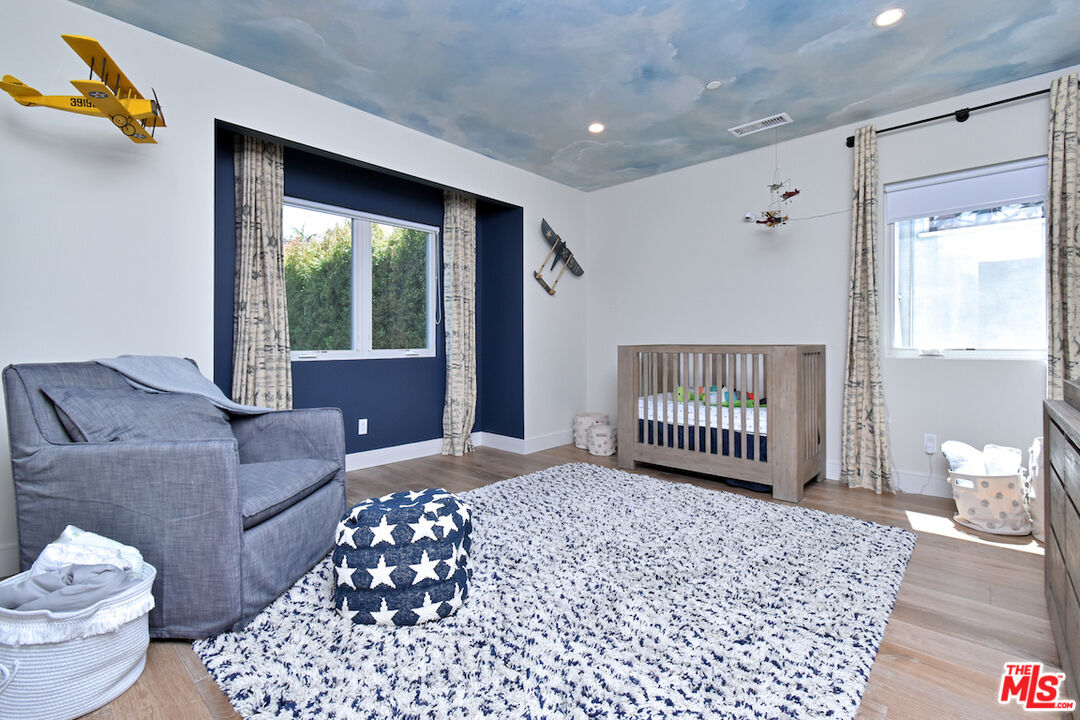 922 Berkeley Street Santa Monica, CA 90403 - Photo 14 of 33 a living room with a couch and a table