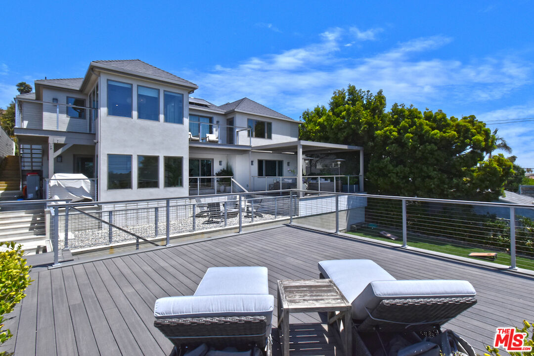 922 Berkeley Street Santa Monica, CA 90403 - Photo 2 of 33 a balcony with table and chairs