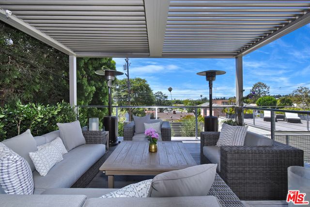 a outdoor living space with patio furniture and garden view