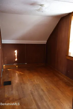 a bathroom with a toilet and shower