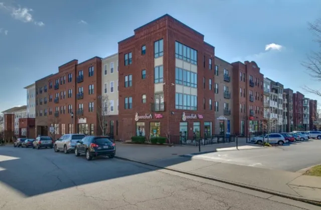 a city street lined with buildings and cars