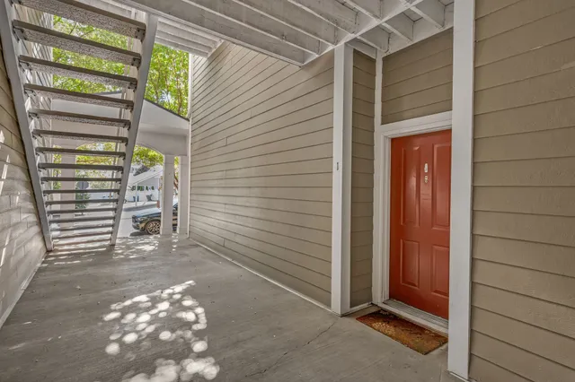 a view of a door and chair in the room