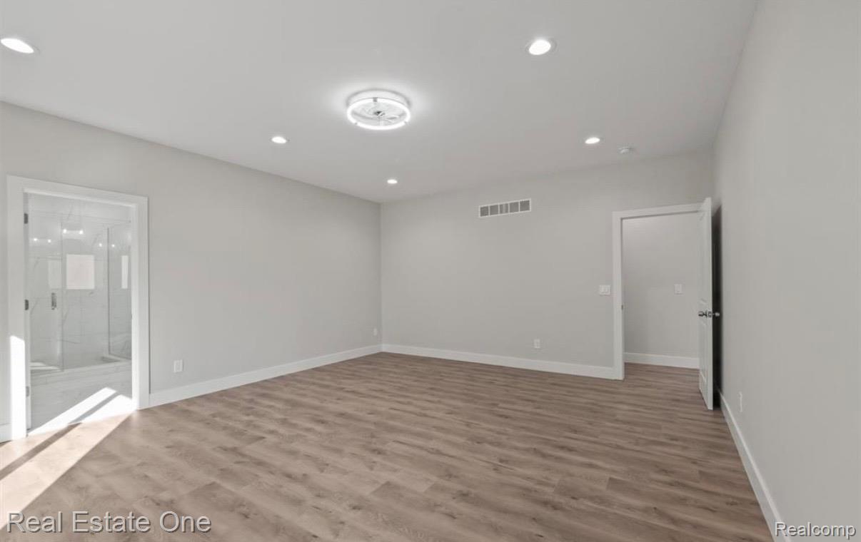 5636 Paris Street Sterling Heights, MI 48310 - Photo 15 of 37 Empty room with recessed lighting and light wood-style floors