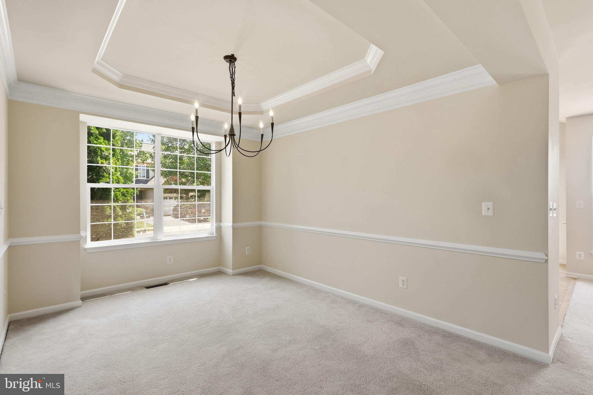19617 Edgemont Square Ashburn, VA 20147 - Photo 9 of 65 an empty room with windows and outdoor view