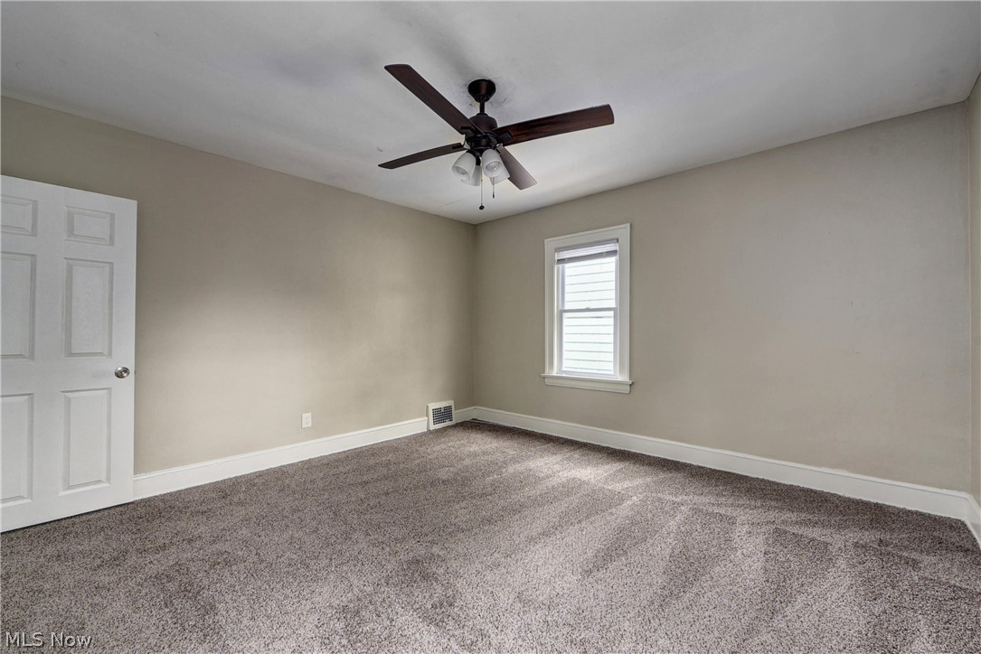 2115 Marlindale Road Cleveland Heights, OH 44118 - Photo 10 of 19 Empty room featuring carpet floors and ceiling fan