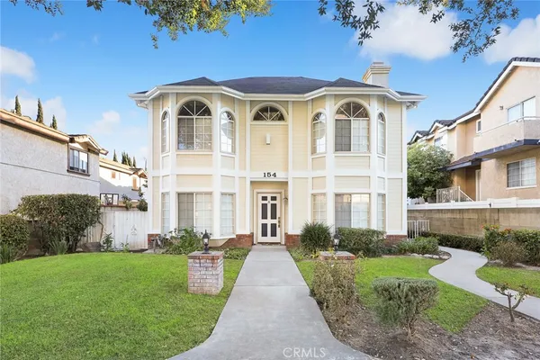 front view of a house with a yard