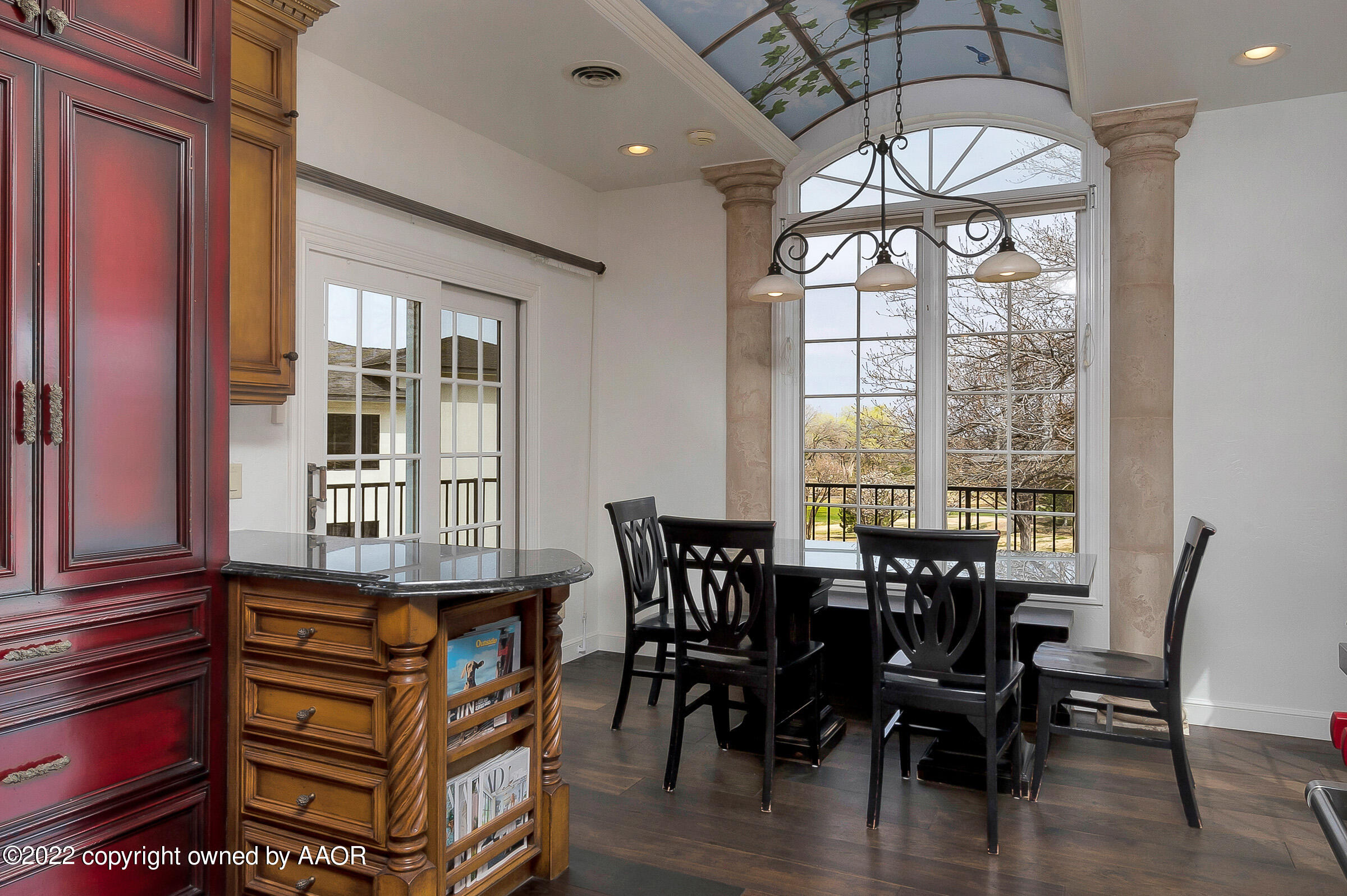 2 Snead Lane Amarillo, TX 79124 - Photo 21 of 76 a dining room with wooden floor a chandelier a wooden table and chairs