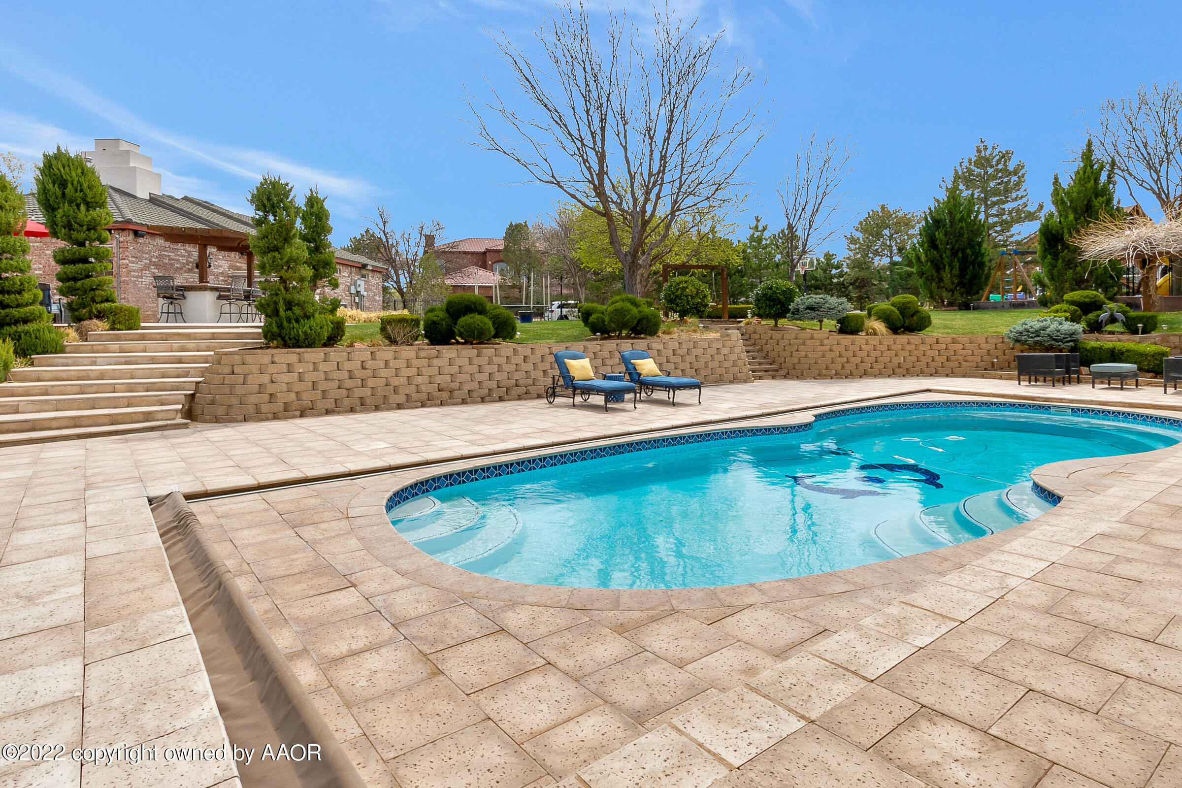 2 Snead Lane Amarillo, TX 79124 - Photo 52 of 76 a view of a swimming pool with a lounge chairs