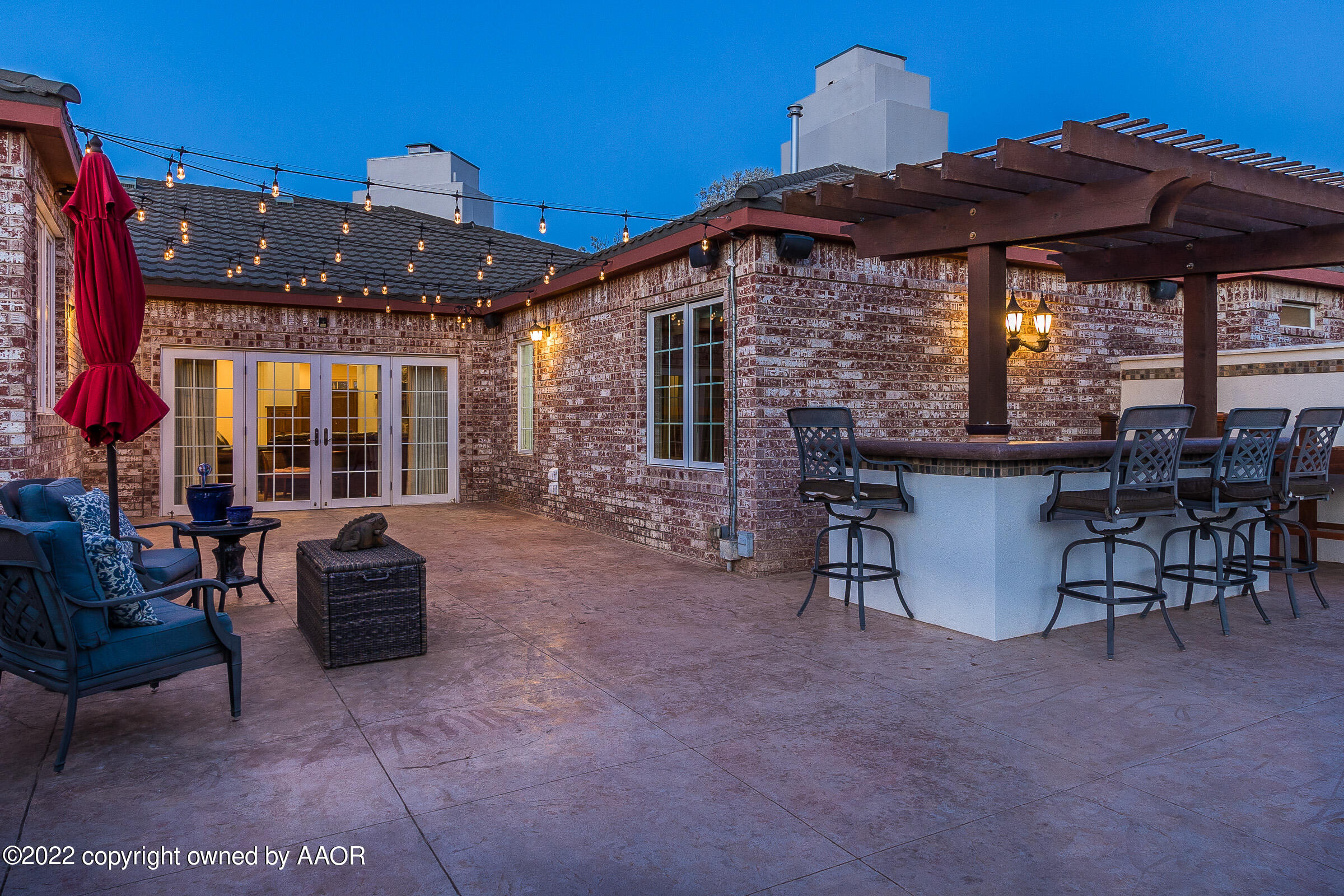 2 Snead Lane Amarillo, TX 79124 - Photo 68 of 76 a view of a patio with a table and chairs under an umbrella