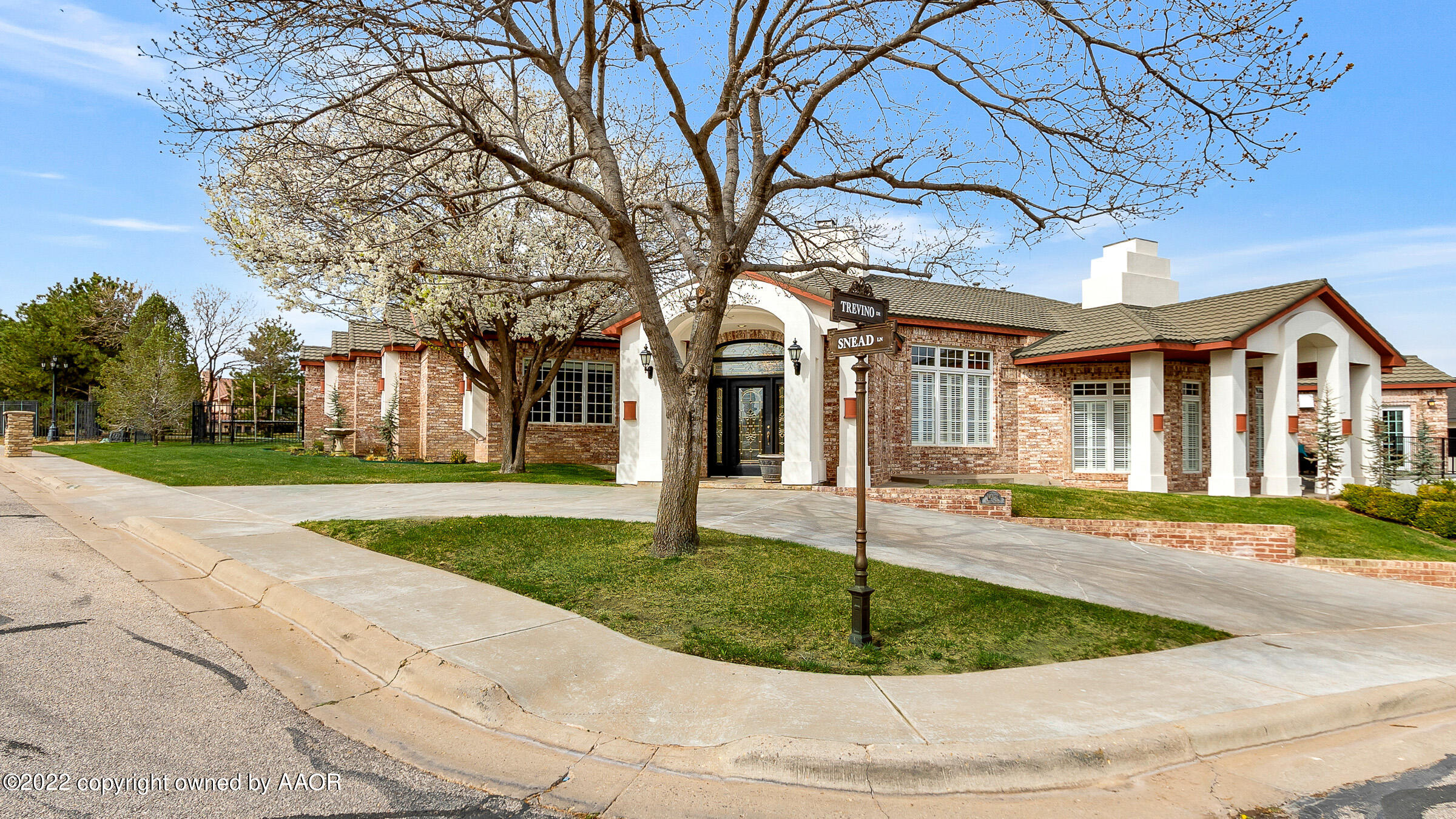 2 Snead Lane Amarillo, TX 79124 - Photo 75 of 76 a view of a white house with a small yard and large tree