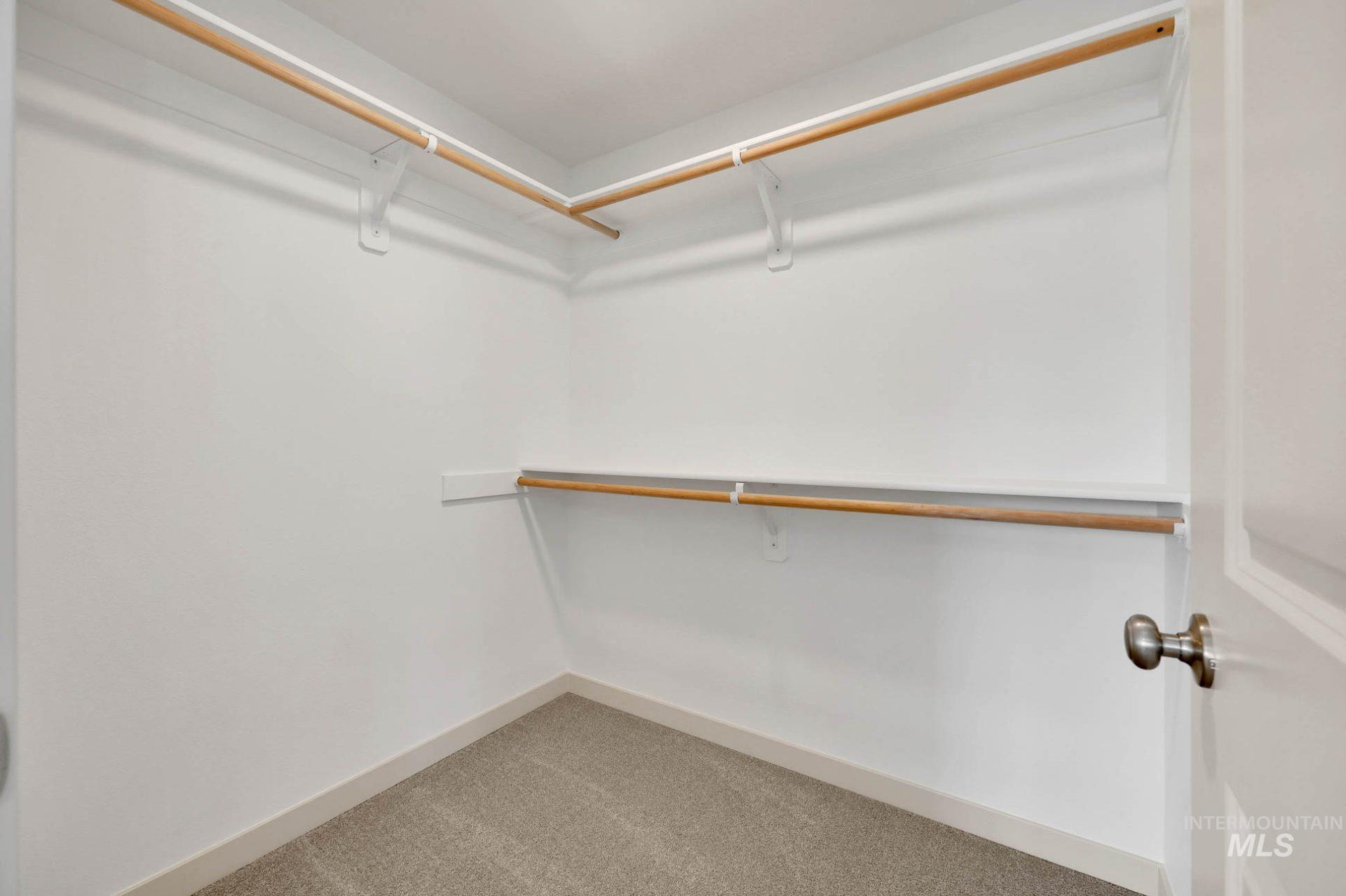 3305 East Fitz Roy Street Kuna, ID 83634 - Photo 21 of 23 Walk in closet featuring light carpet