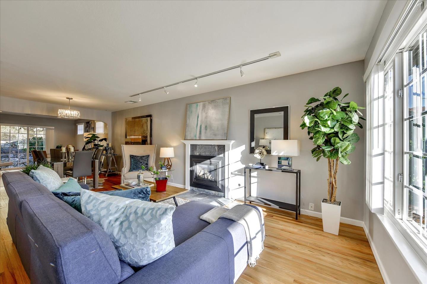 1371 Linda Mar Boulevard Pacifica, CA 94044 - Photo 2 of 30 a living room with furniture and a wooden floor