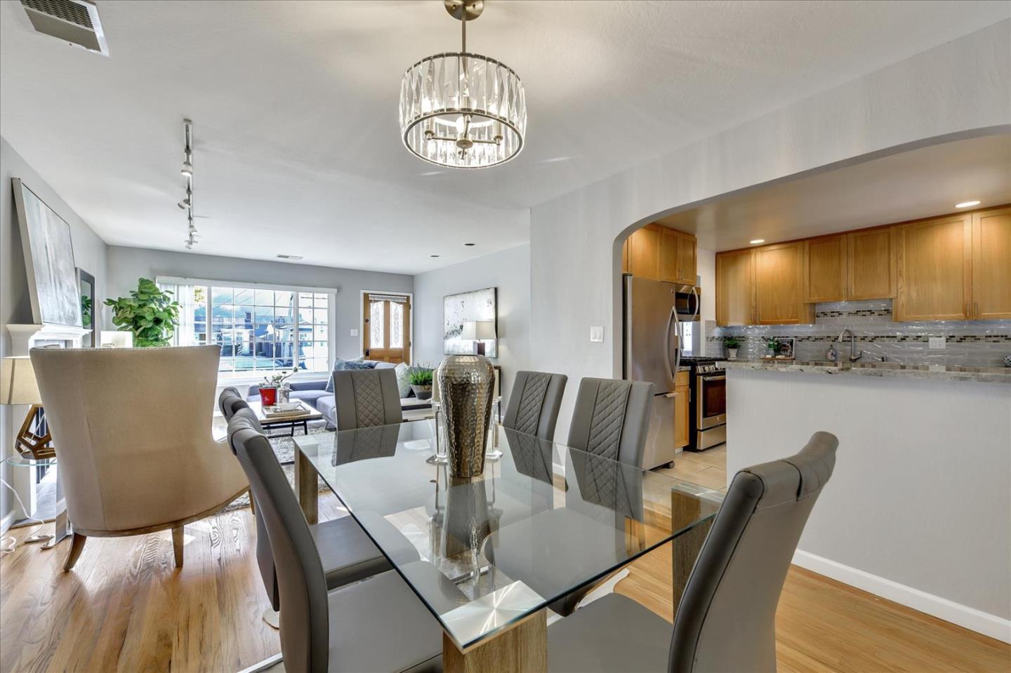1371 Linda Mar Boulevard Pacifica, CA 94044 - Photo 11 of 30 a view of a dining room with furniture window and wooden floor