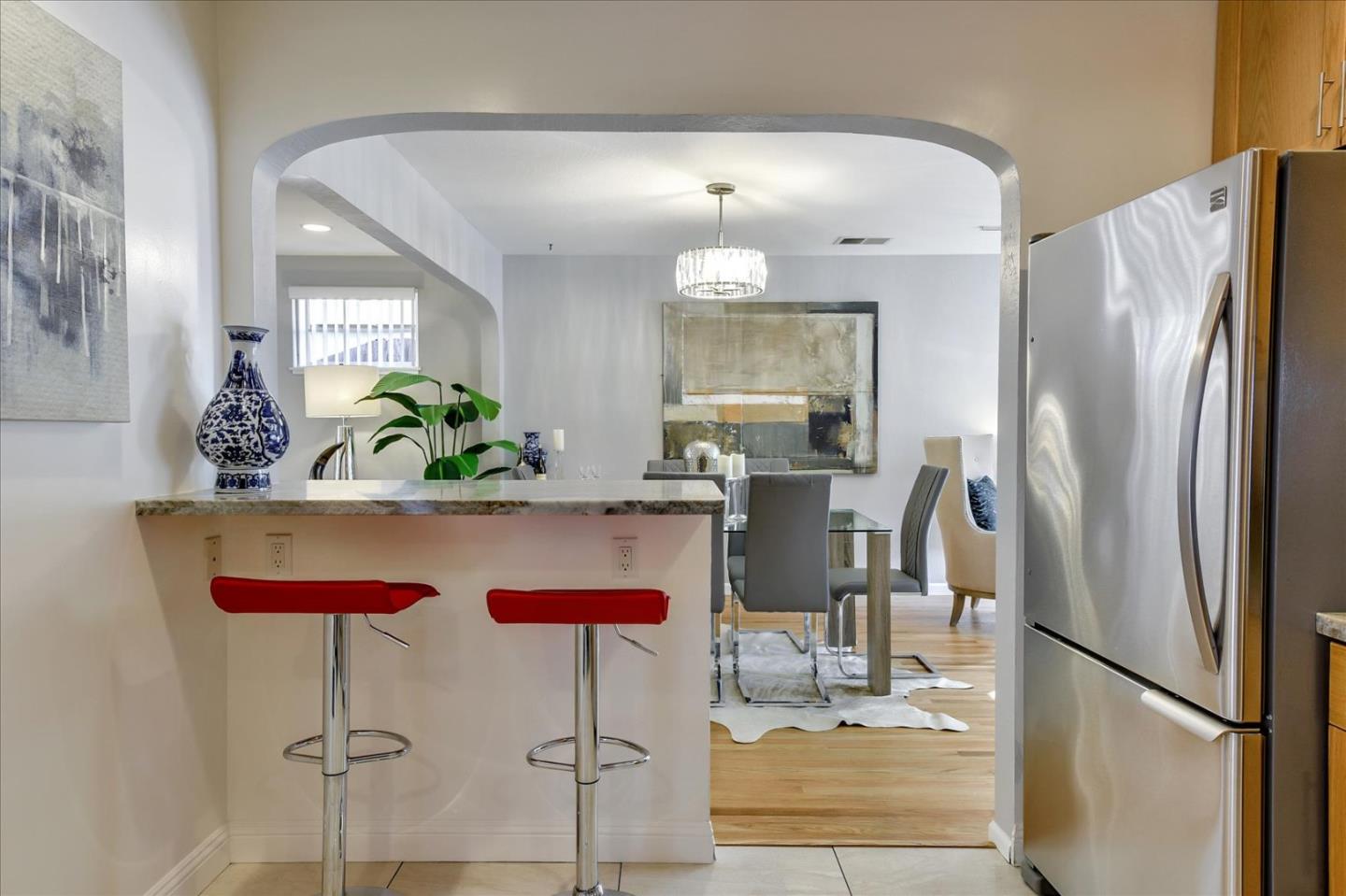 1371 Linda Mar Boulevard Pacifica, CA 94044 - Photo 13 of 30 a kitchen with stainless steel appliances granite countertop a refrigerator and a stove top oven