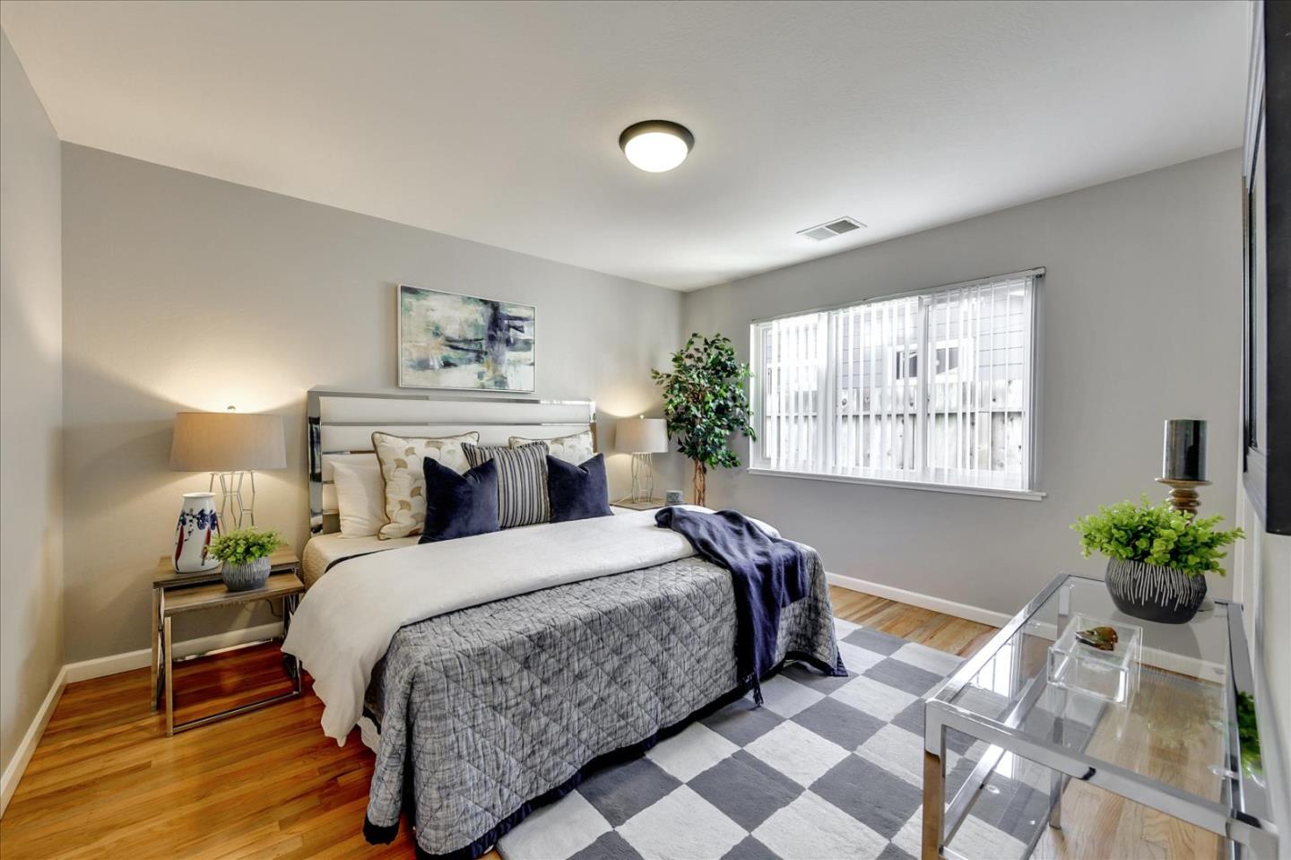 1371 Linda Mar Boulevard Pacifica, CA 94044 - Photo 20 of 30 a bedroom with a bed and window