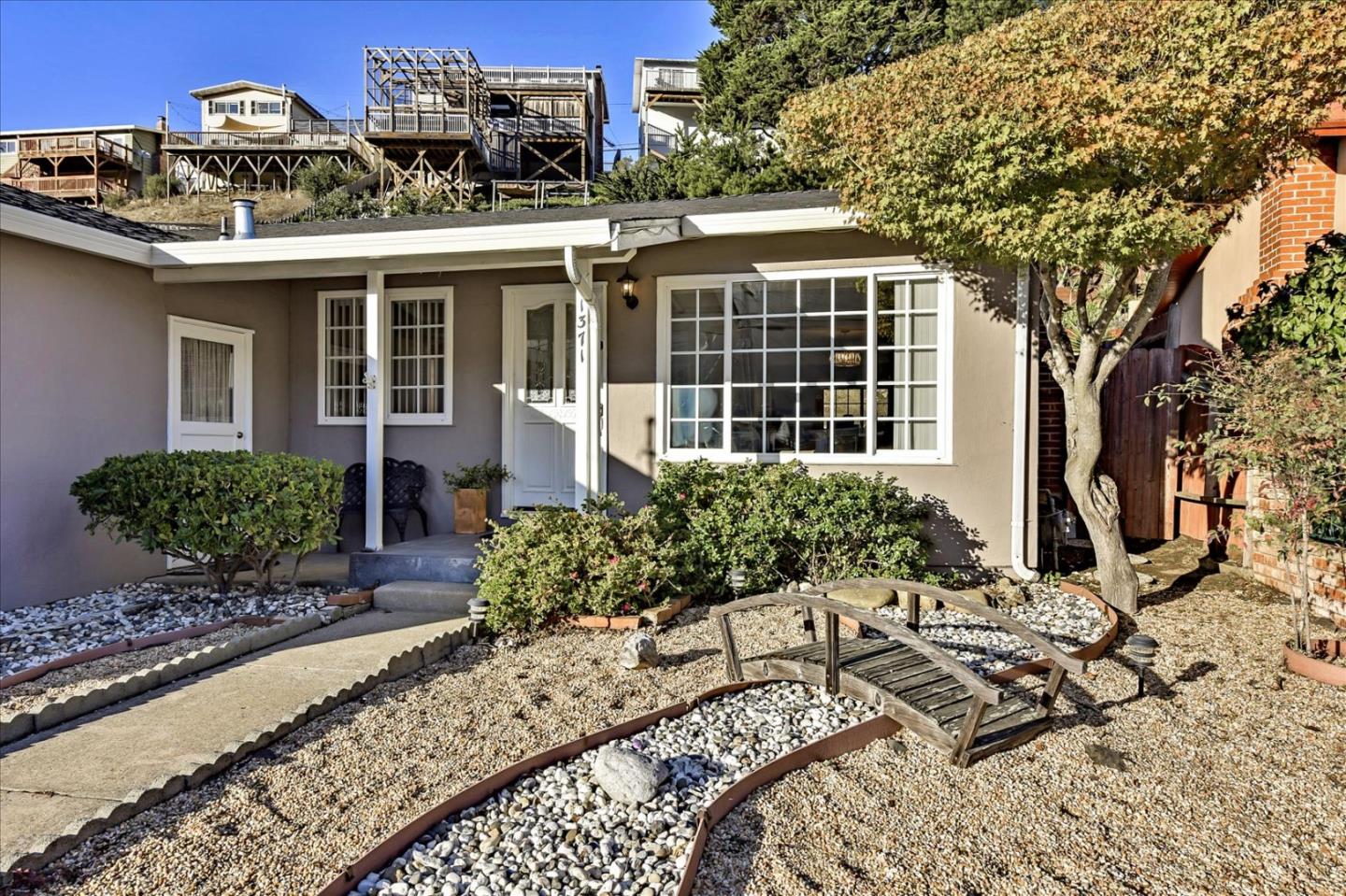 1371 Linda Mar Boulevard Pacifica, CA 94044 - Photo 3 of 30 a view of a house with a small yard and plants
