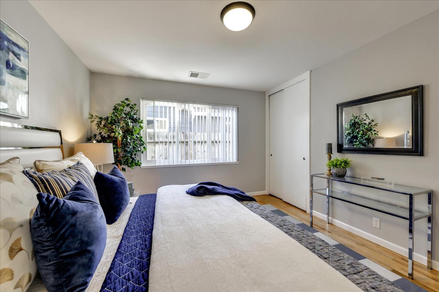 1371 Linda Mar Boulevard Pacifica, CA 94044 - Photo 22 of 30 a bedroom with a bed and a window