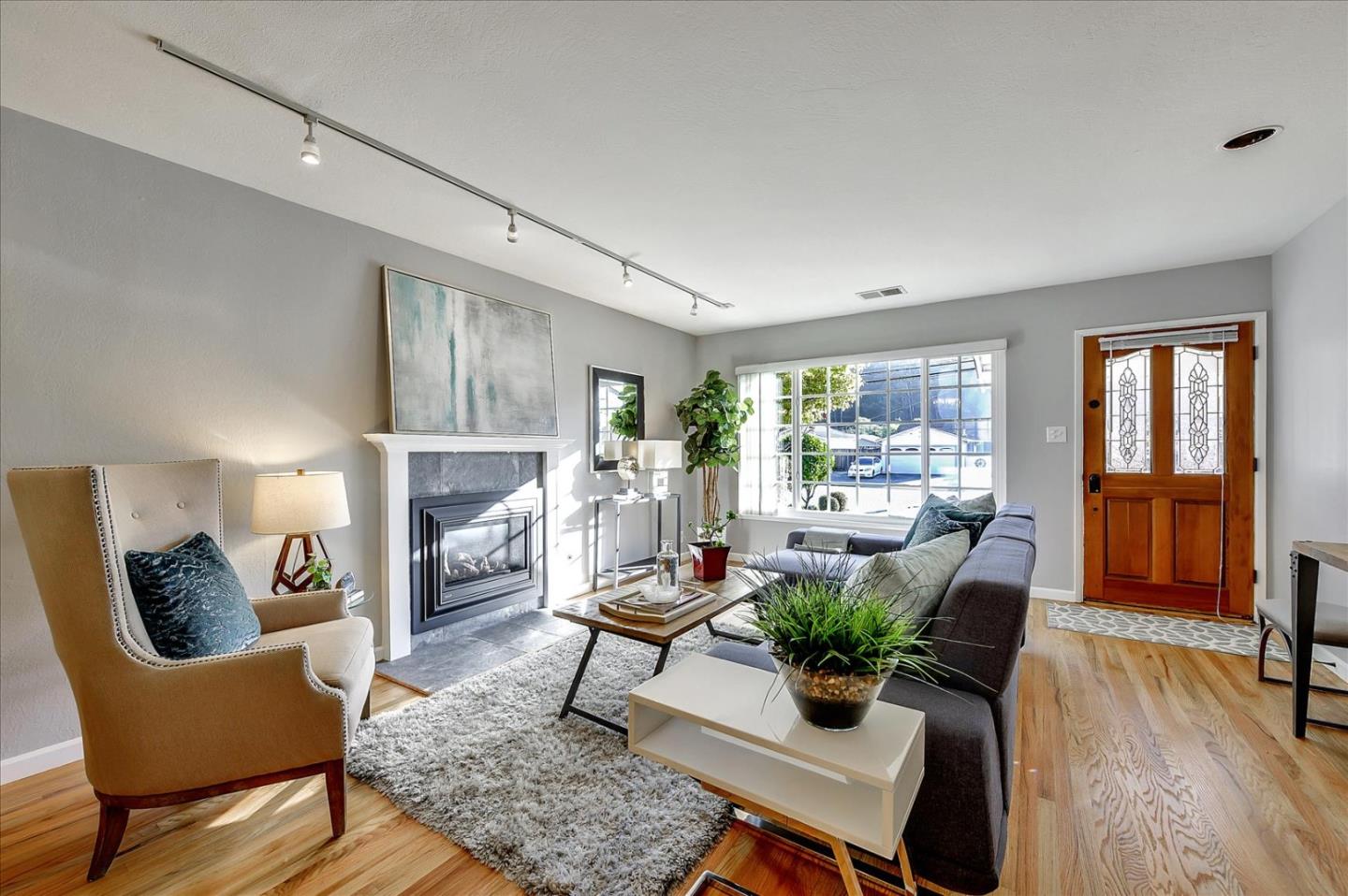 1371 Linda Mar Boulevard Pacifica, CA 94044 - Photo 4 of 30 a living room with furniture and a fireplace