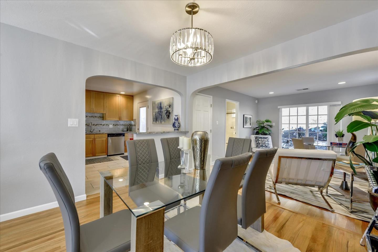 1371 Linda Mar Boulevard Pacifica, CA 94044 - Photo 6 of 30 a view of a dining room with furniture and a chandelier