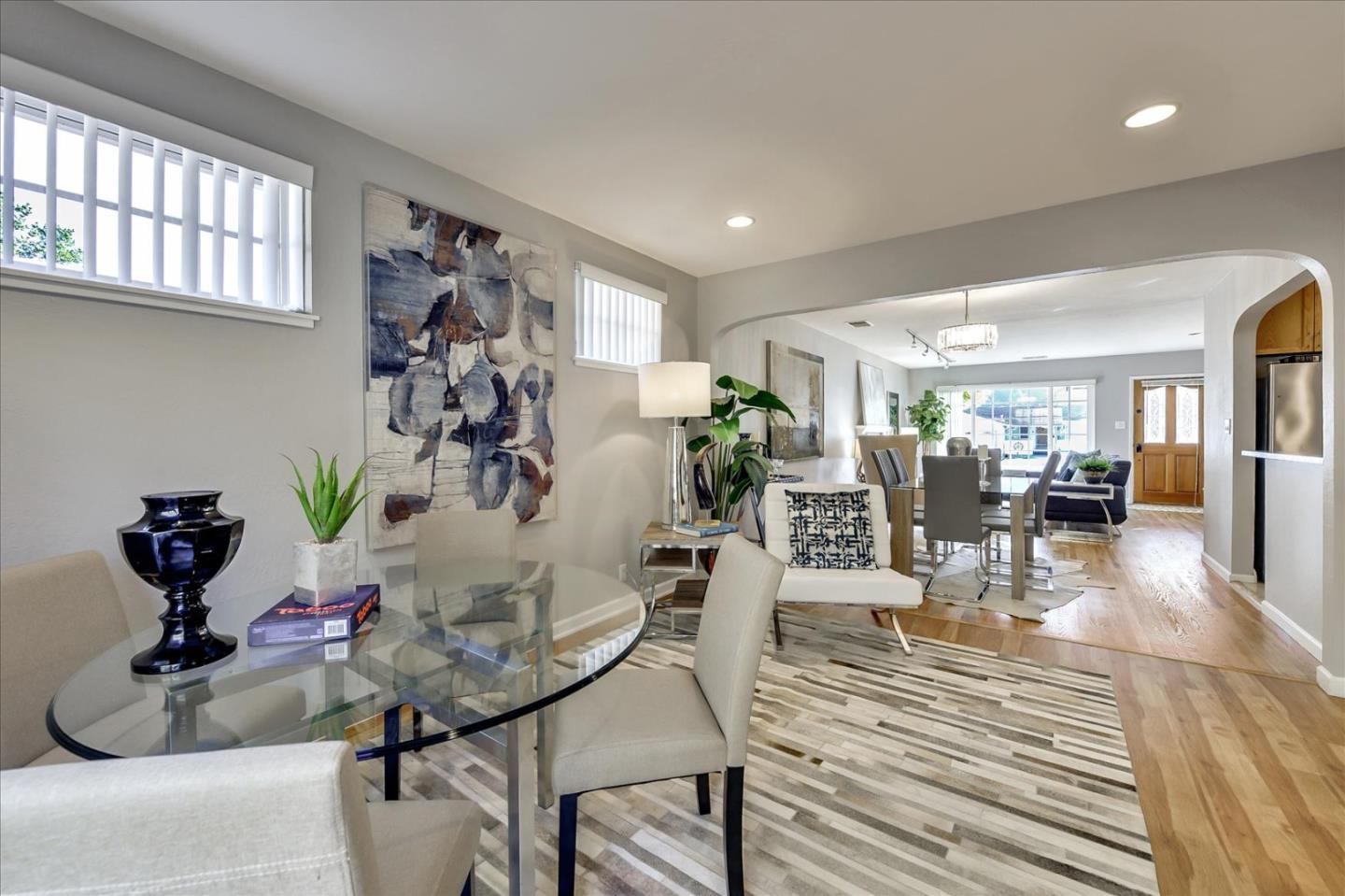 1371 Linda Mar Boulevard Pacifica, CA 94044 - Photo 10 of 30 a view of a livingroom and dining room with wooden floor