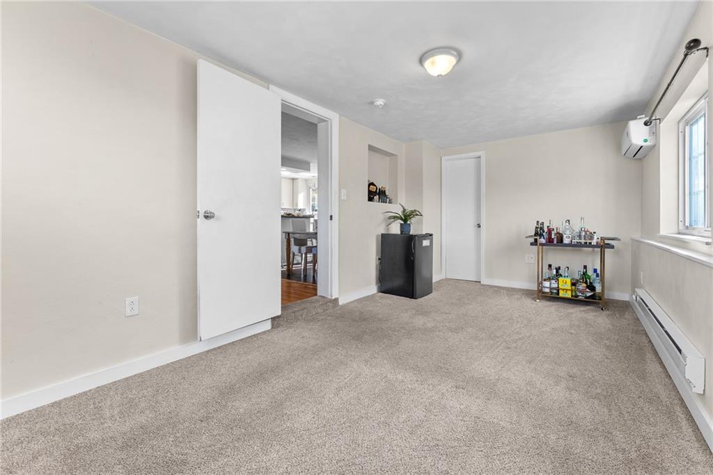 400 Pearce Road Pittsburgh, PA 15234 - Photo 12 of 31 an empty room with furniture and a window