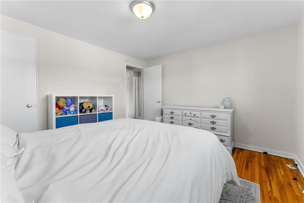 400 Pearce Road Pittsburgh, PA 15234 - Photo 16 of 31 a bed sitting in a bedroom and a chandelier