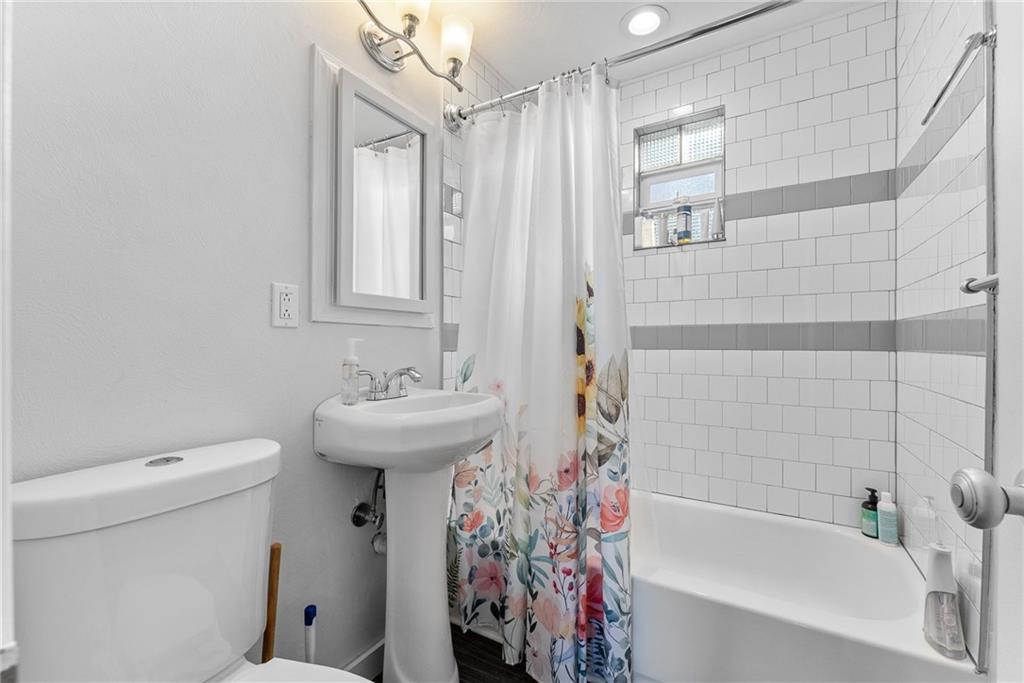 400 Pearce Road Pittsburgh, PA 15234 - Photo 18 of 31 a bathroom with a sink a toilet and shower