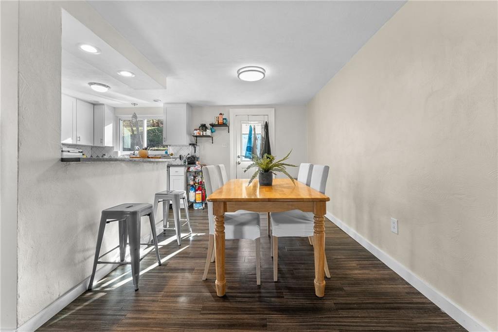 400 Pearce Road Pittsburgh, PA 15234 - Photo 6 of 31 a view of a dining room with furniture and wooden floor