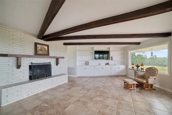 a view of livingroom with furniture and flat screen tv