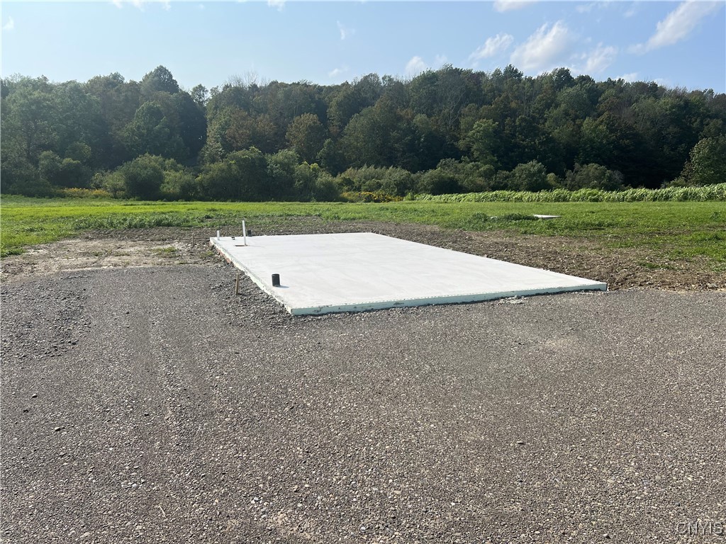 165 Graham Road Smyrna, NY 13464 - Photo 3 of 14 Poured pad located on the property