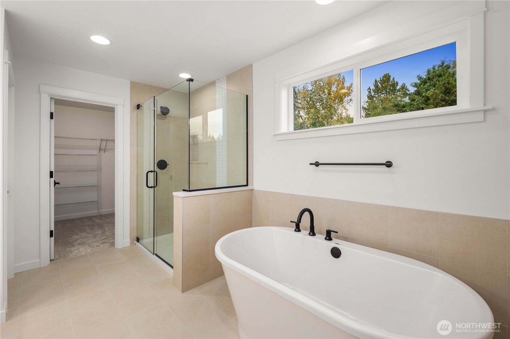 722 211th Place Southeast Bothell, WA 98021 - Photo 20 of 27 a white bath tub sitting next to a bathroom