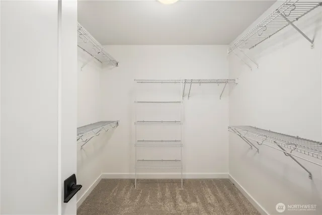 a bathroom with a double vanity sink toilet and shower