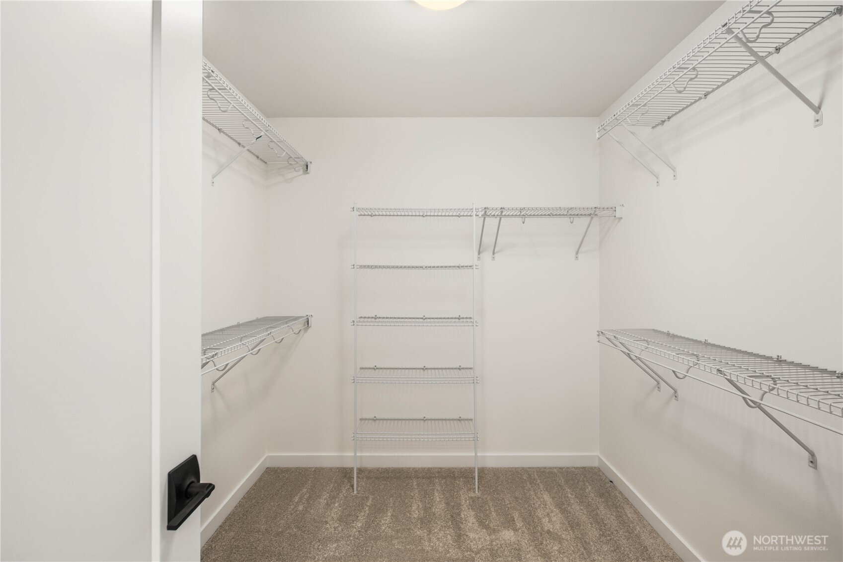 722 211th Place Southeast Bothell, WA 98021 - Photo 21 of 27 a view of walk in closet with empty racks