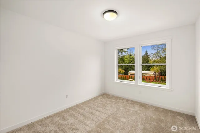 a view of an entryway of house with backyard