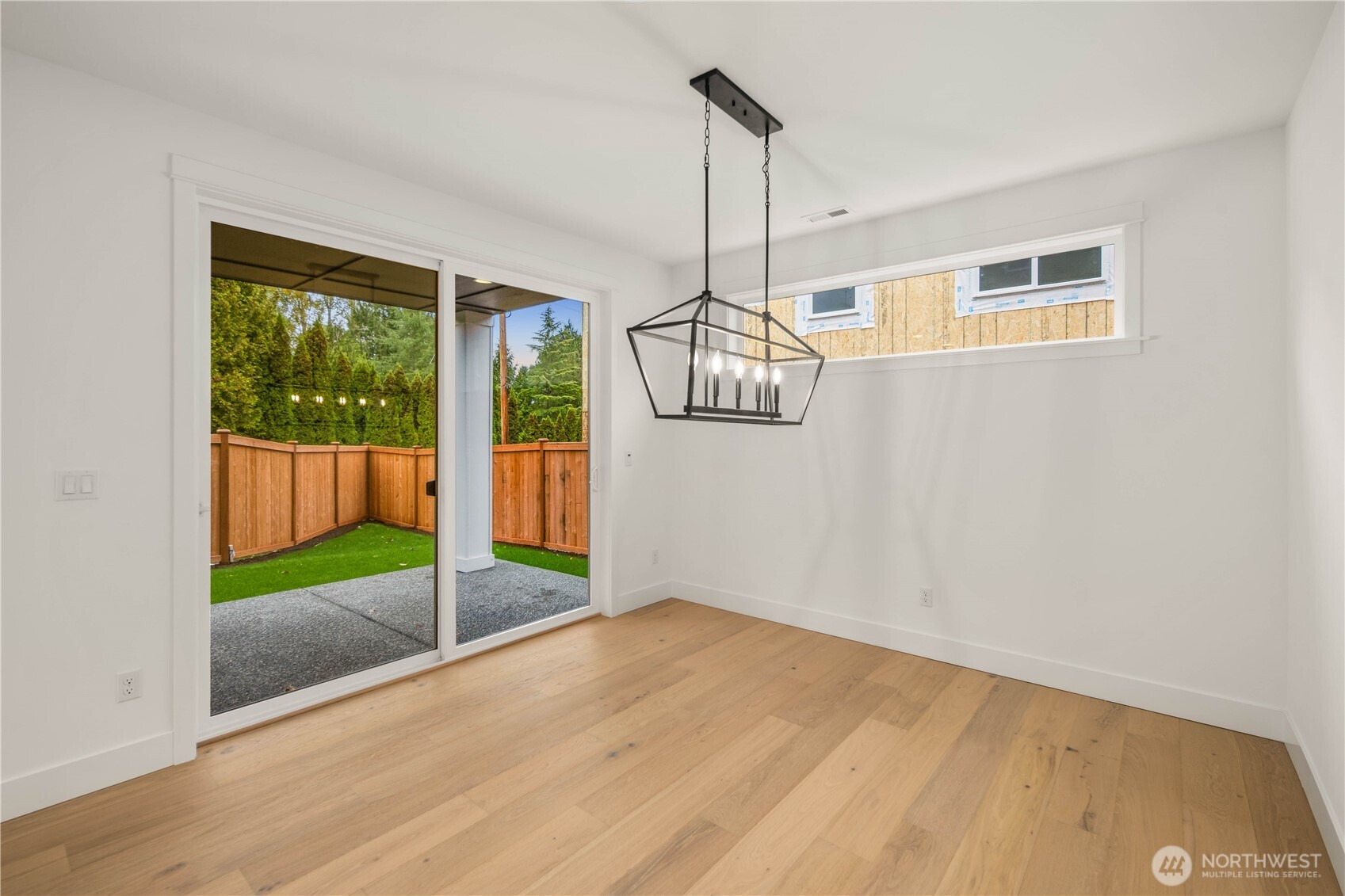 722 211th Place Southeast Bothell, WA 98021 - Photo 5 of 27 a view of empty room with wooden floor and windows