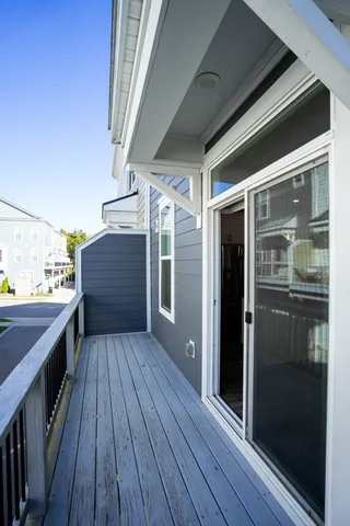 a view of a balcony with wooden floor