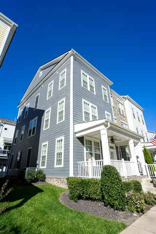 a front view of a building with a yard