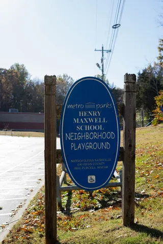 a front view of a house with a trees