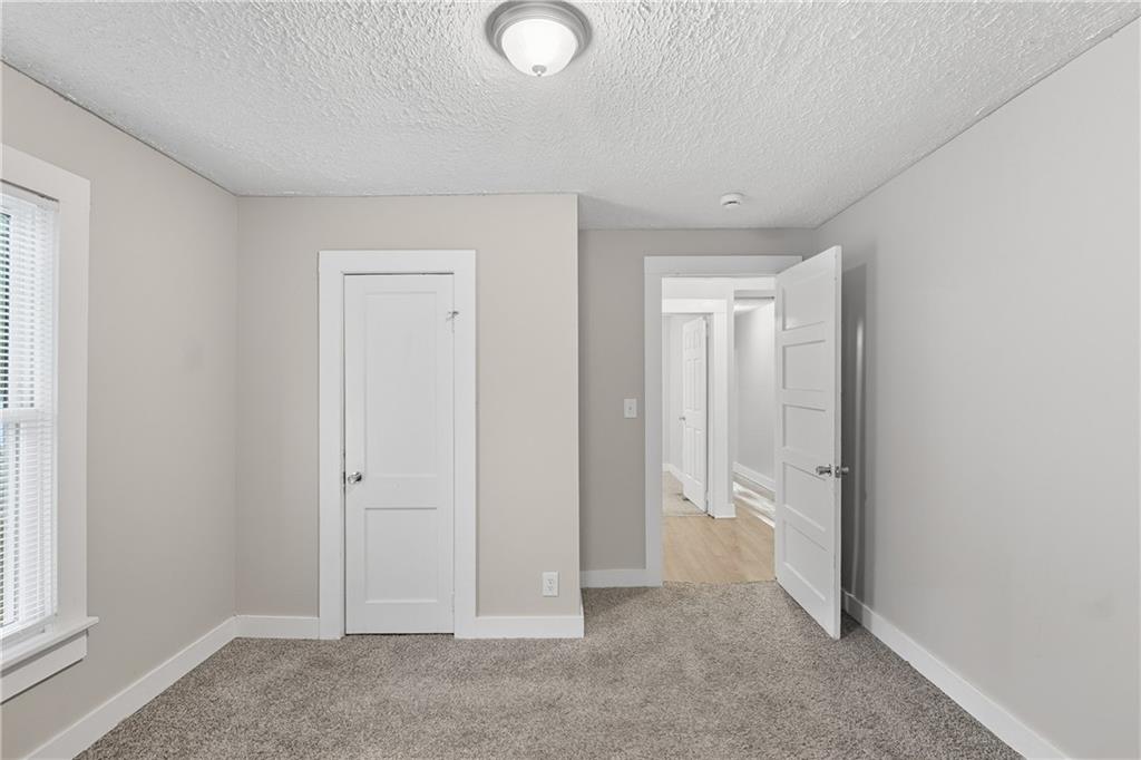 55 Wyman Street Southeast Atlanta, GA 30317 - Photo 12 of 25 an empty room with windows and closet