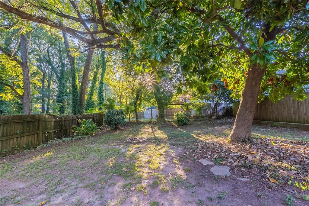 55 Wyman Street Southeast Atlanta, GA 30317 - Photo 23 of 25 a backyard of a house with lots of green space