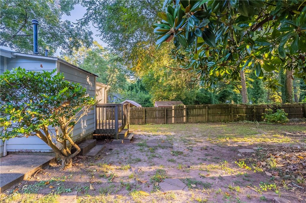 55 Wyman Street Southeast Atlanta, GA 30317 - Photo 24 of 25 a view of house with backyard and a tree