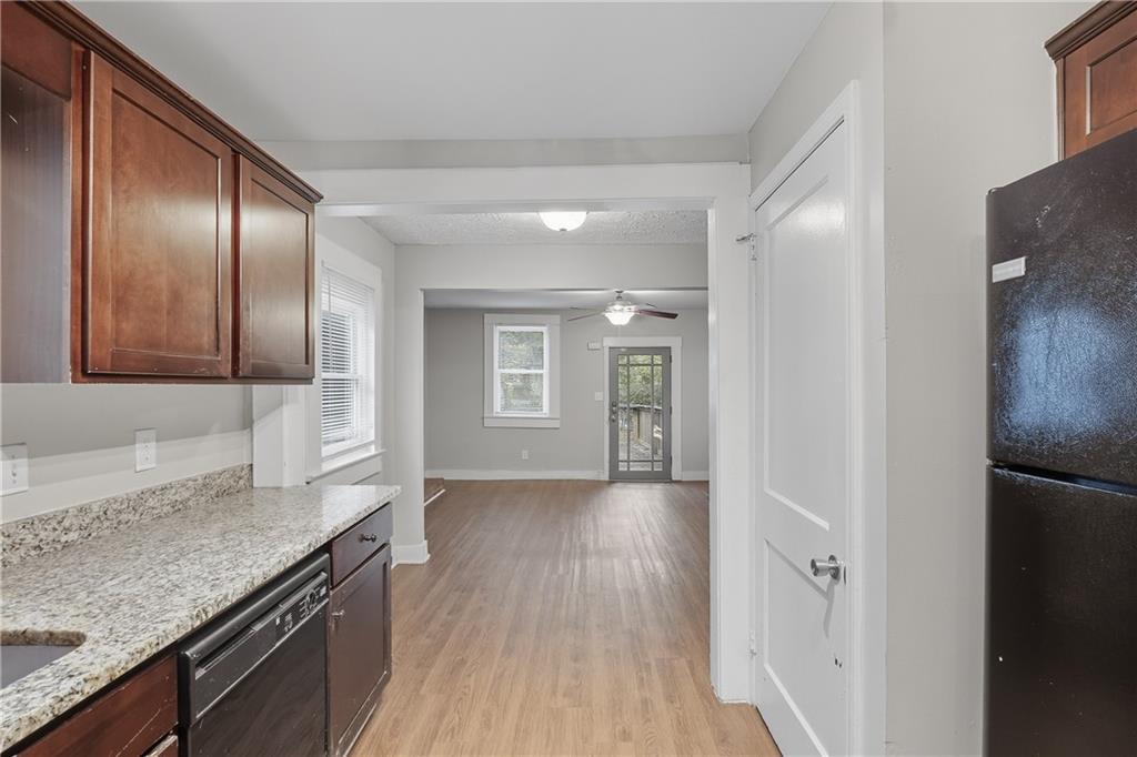 55 Wyman Street Southeast Atlanta, GA 30317 - Photo 9 of 25 a view of a kitchen cabinets a sink and dishwasher in a kitchen
