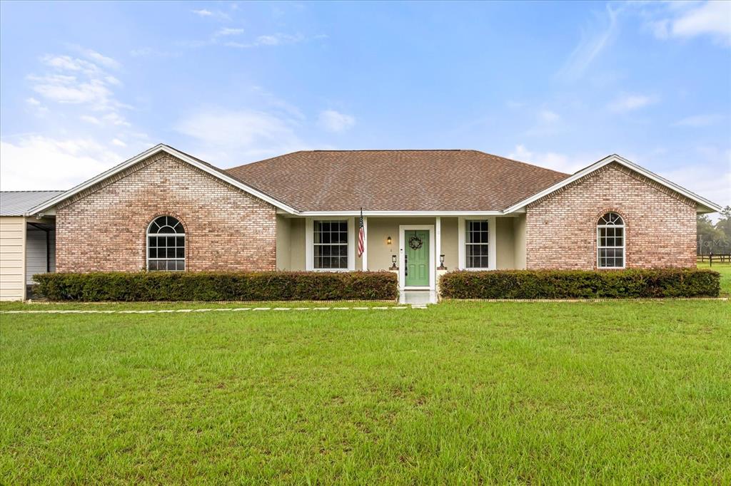 36525 Reserve Drive Eustis, FL 32736 - Photo 1 of 1 a front view of house with yard and green space