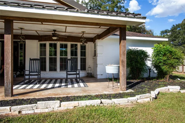 a front view of a house with a yard balcony