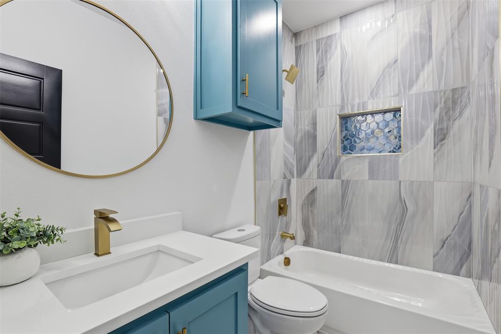 6657 Buffalo Ridge Circle Godley, TX 76044 - Photo 21 of 31 a bathroom with a sink a toilet and a mirror