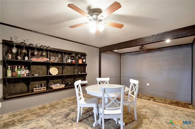 a dining room with furniture and window