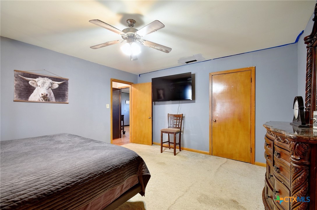 1017 Highway 87 Smiley, TX 78159 - Photo 16 of 30 a bedroom with a bed and a flat screen tv